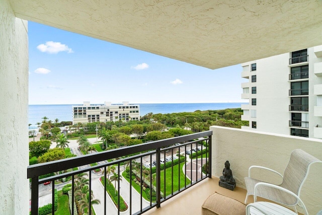 balcony featuring a water view