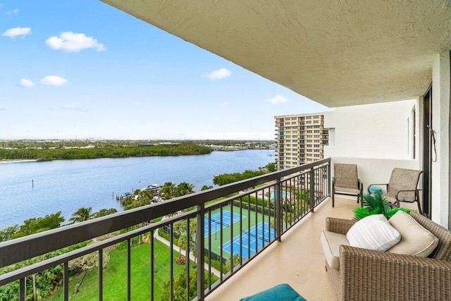 balcony featuring a water view