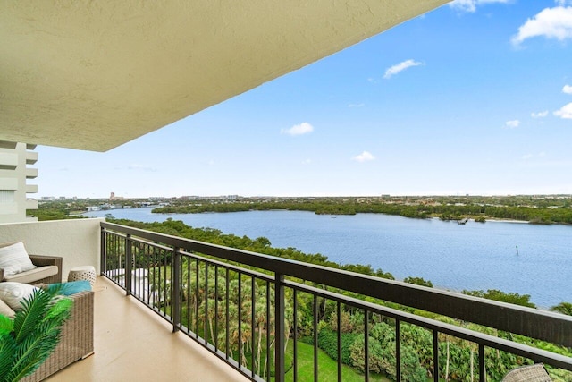 balcony featuring a water view