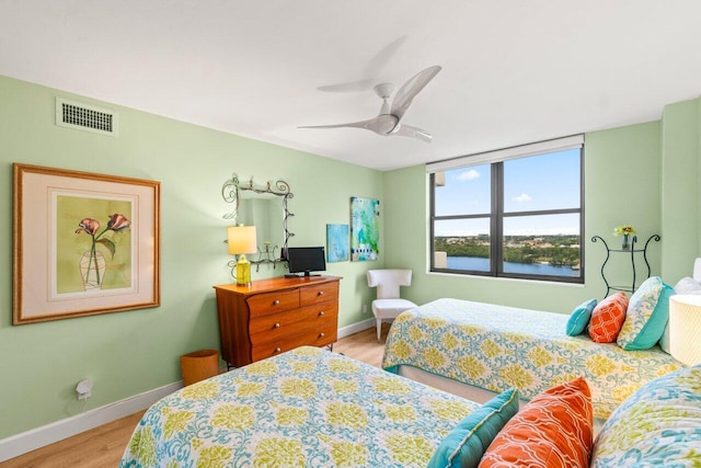 bedroom featuring ceiling fan and light hardwood / wood-style floors