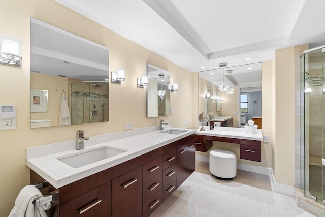 bathroom with tile patterned flooring, vanity, and walk in shower