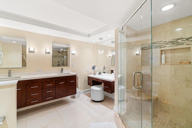 bathroom featuring tile patterned flooring, vanity, and an enclosed shower