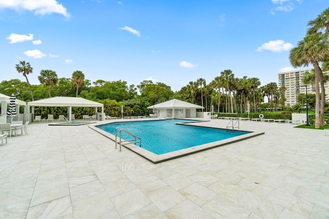 view of swimming pool with a patio area