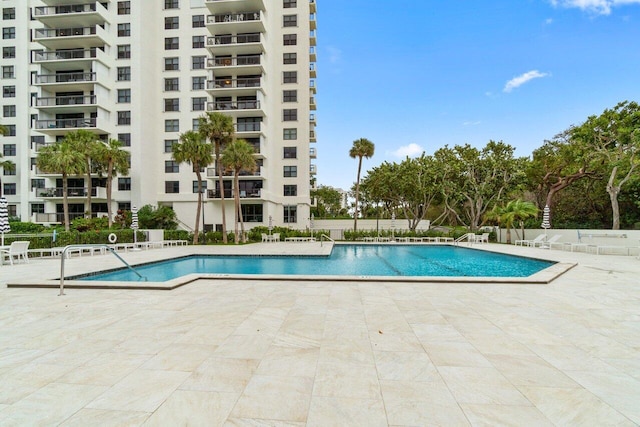 view of swimming pool with a patio area