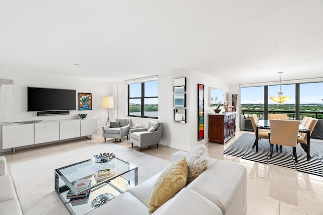 living room with light tile patterned floors, a wealth of natural light, and expansive windows