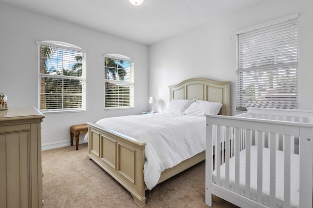 bedroom with light colored carpet