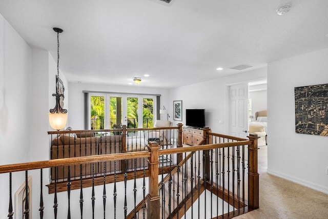 hall featuring french doors and carpet flooring