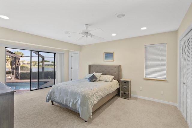 bedroom with ceiling fan, light colored carpet, access to exterior, and a closet