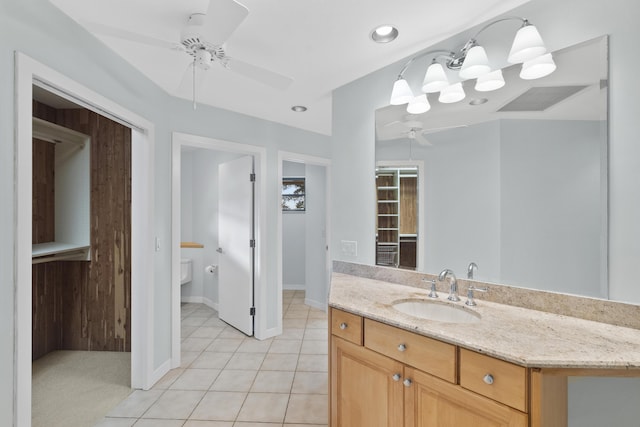 bathroom featuring ceiling fan, vanity, toilet, and tile patterned flooring