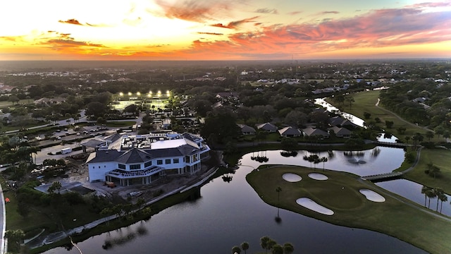 aerial view at dusk with a water view