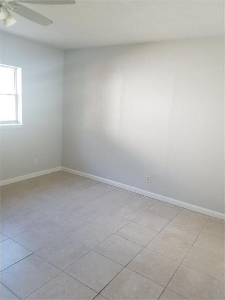 unfurnished room with ceiling fan