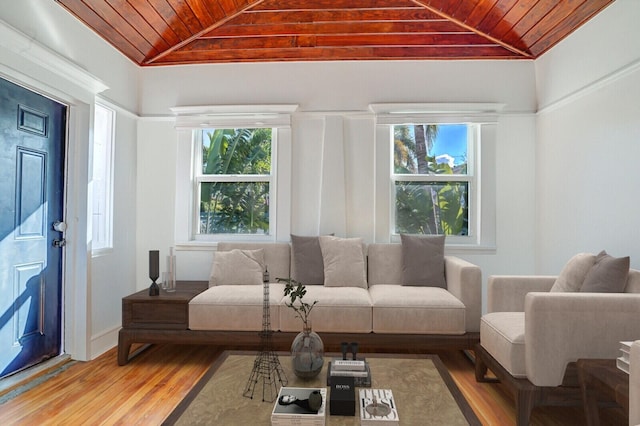 living room featuring wood-type flooring, vaulted ceiling, and wood ceiling