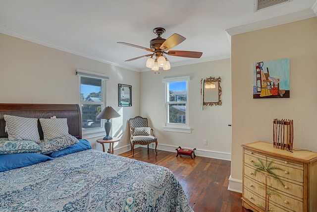 bedroom featuring crown molding, ceiling fan, and dark hardwood / wood-style floors