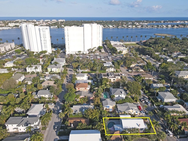 birds eye view of property with a water view