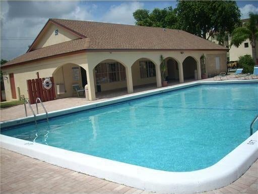 view of swimming pool featuring a patio