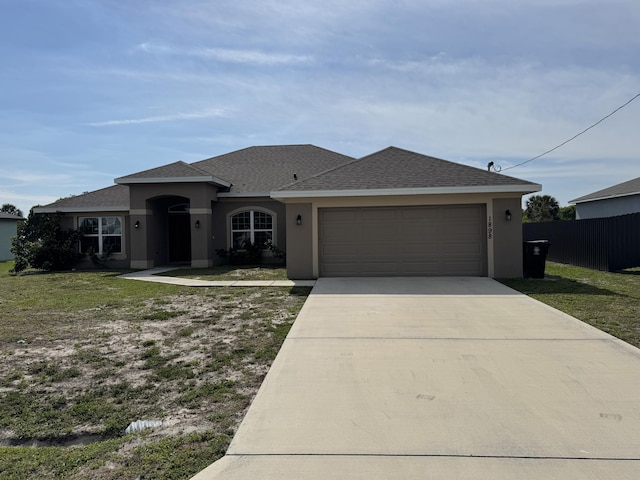 view of front facade featuring a garage, fence, concrete driveway, roof with shingles, and stucco siding