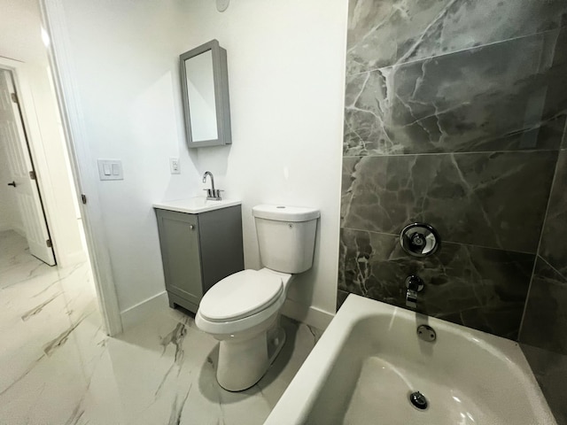 bathroom with toilet, marble finish floor, vanity, and baseboards