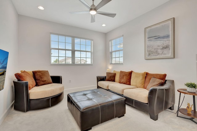 living room with light colored carpet and ceiling fan