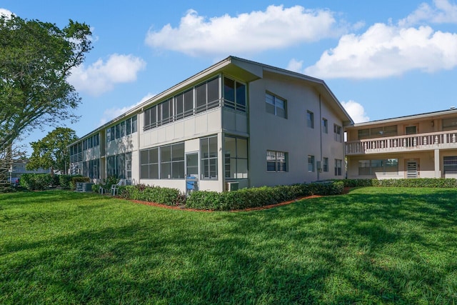 view of home's exterior featuring a lawn