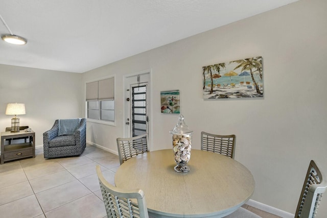 dining space with light tile patterned floors