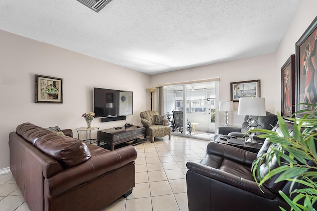 living room featuring light tile patterned floors and a textured ceiling