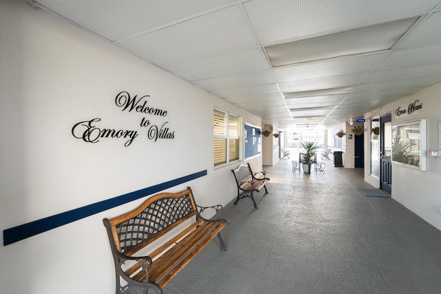 hallway featuring a drop ceiling