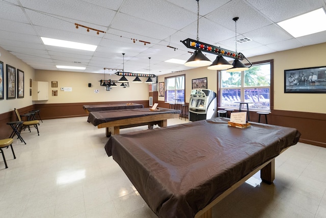 game room with pool table and a paneled ceiling