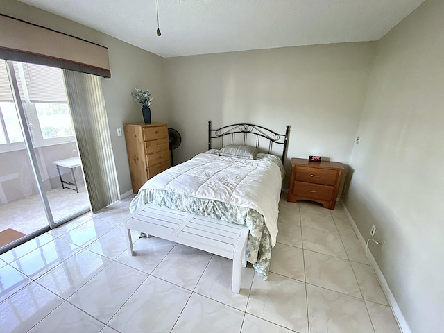 tiled bedroom with access to outside