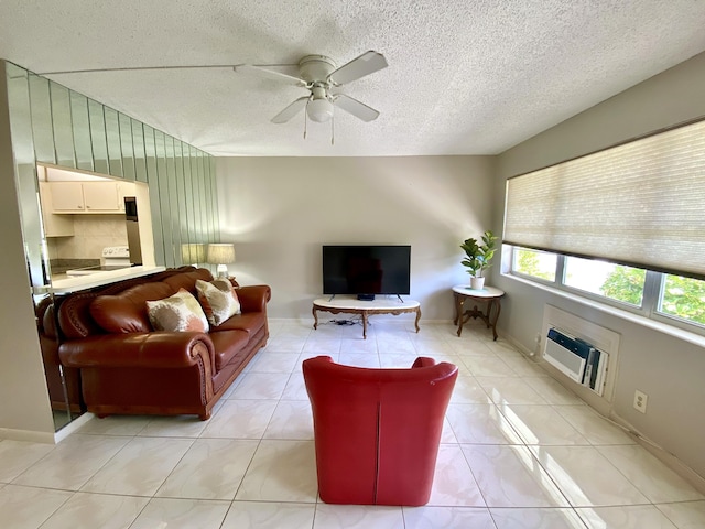 tiled living room with a textured ceiling, an AC wall unit, and ceiling fan