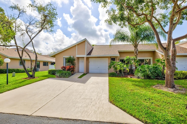 ranch-style house with a garage and a front yard