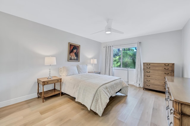 bedroom featuring light hardwood / wood-style floors and ceiling fan