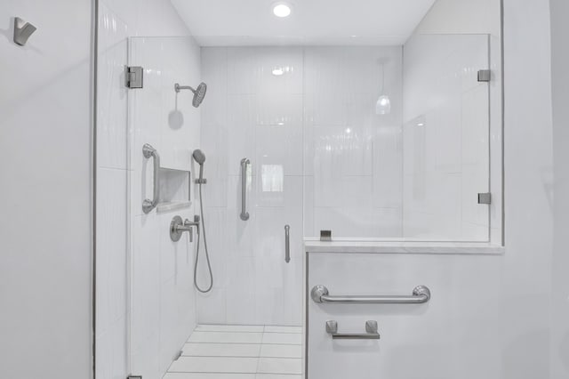 bathroom with a shower with shower door