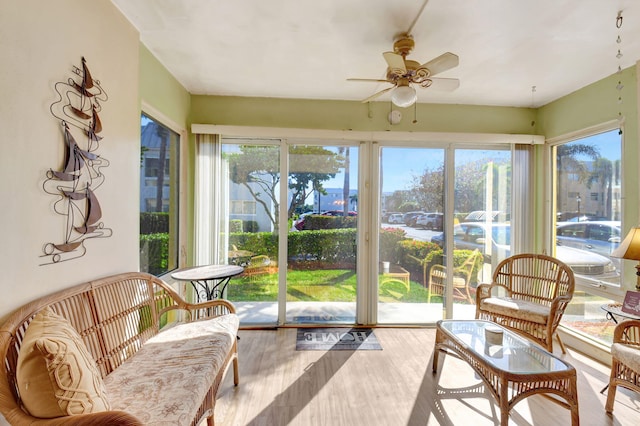 sunroom / solarium featuring ceiling fan and a wealth of natural light