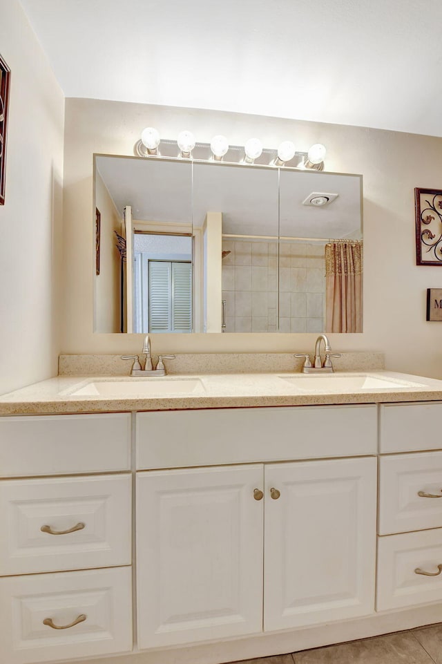 bathroom with vanity and curtained shower