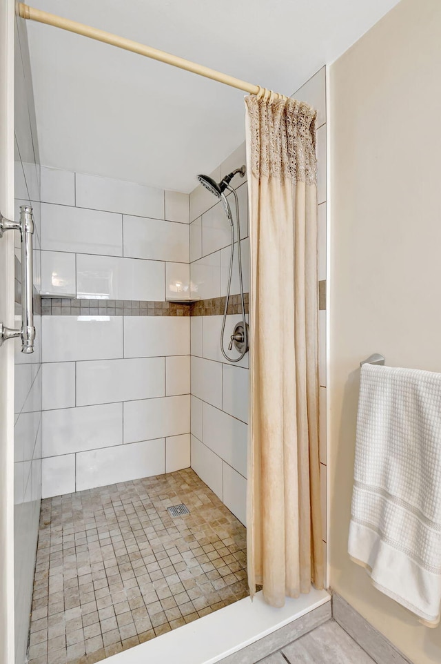 bathroom featuring a shower with curtain