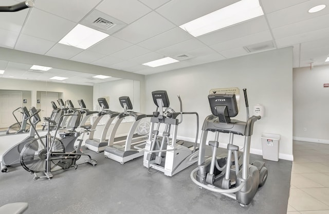 workout area featuring a paneled ceiling