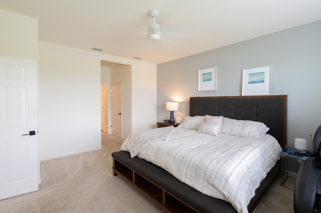 bedroom featuring light colored carpet