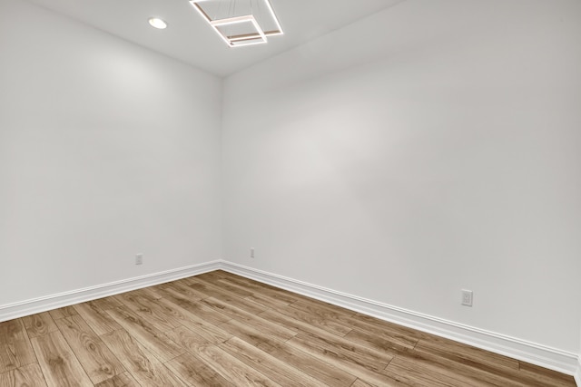 unfurnished room with light hardwood / wood-style flooring