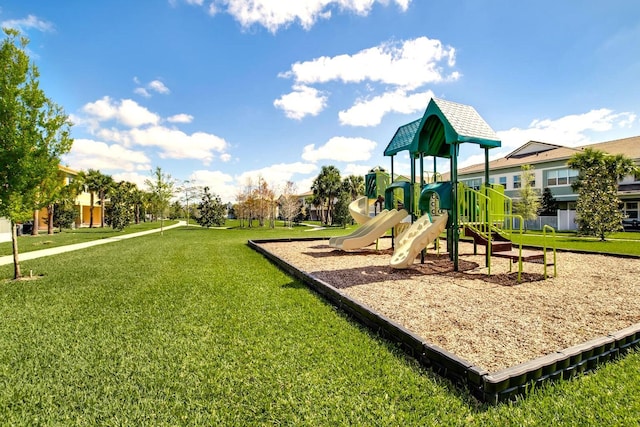 view of jungle gym featuring a lawn