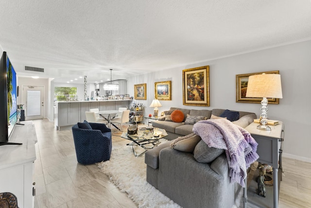 living room featuring a textured ceiling