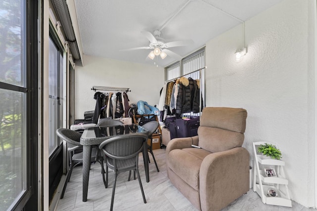 sunroom / solarium with ceiling fan