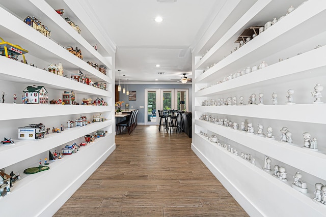 11951 Torreyanna Cir, Palm Beach Gardens, FL 33412 - corridor featuring baseboards, built in shelves, wood finished floors, and recessed lighting