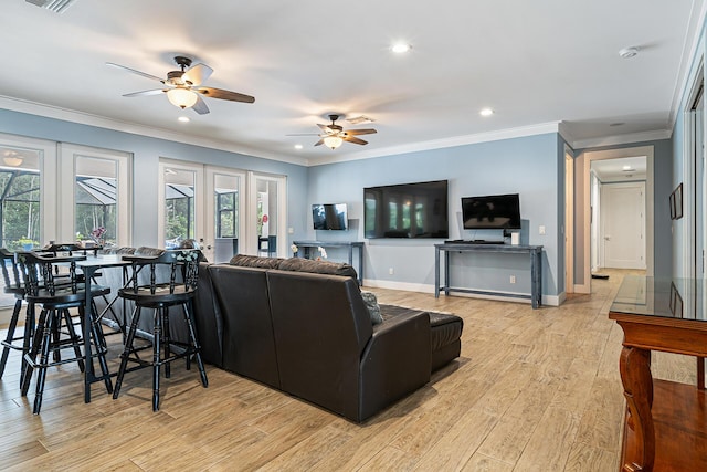 11951 Torreyanna Cir, Palm Beach Gardens, FL 33412 - living room featuring ornamental molding, french doors, light wood-style flooring, and baseboards