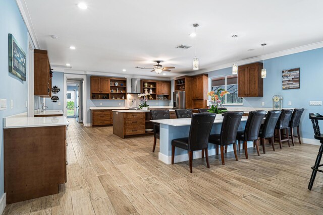 11951 Torreyanna Cir, Palm Beach Gardens, FL 33412 - kitchen with a kitchen island, visible vents, hanging light fixtures, light countertops, and open shelves