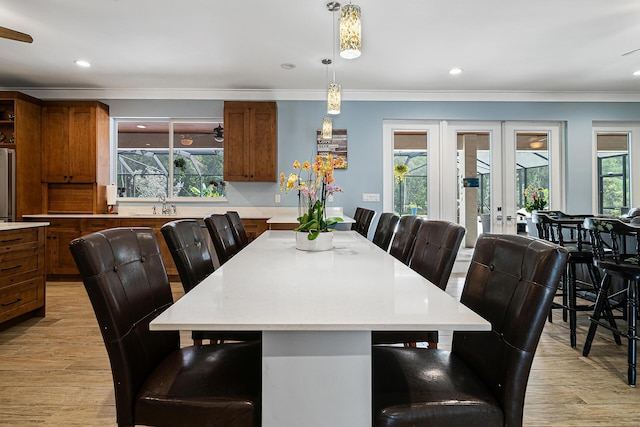 11951 Torreyanna Cir, Palm Beach Gardens, FL 33412 - dining room with light wood-style floors, recessed lighting, ornamental molding, and french doors