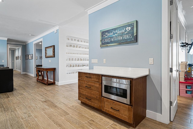 11951 Torreyanna Cir, Palm Beach Gardens, FL 33412 - hall with light wood-type flooring, baseboards, and crown molding