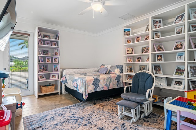 11951 Torreyanna Cir, Palm Beach Gardens, FL 33412 - bedroom with ceiling fan, crown molding, and wood finished floors
