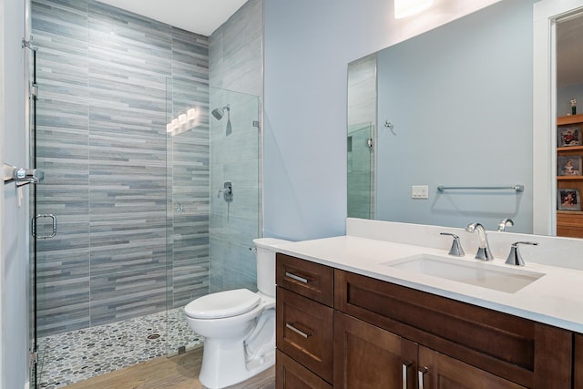 11951 Torreyanna Cir, Palm Beach Gardens, FL 33412 - bathroom featuring a stall shower, vanity, and toilet