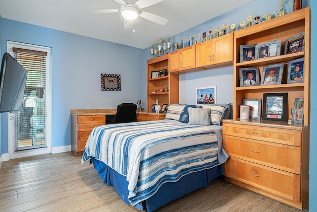 11951 Torreyanna Cir, Palm Beach Gardens, FL 33412 - bedroom featuring light wood finished floors, ceiling fan, and baseboards