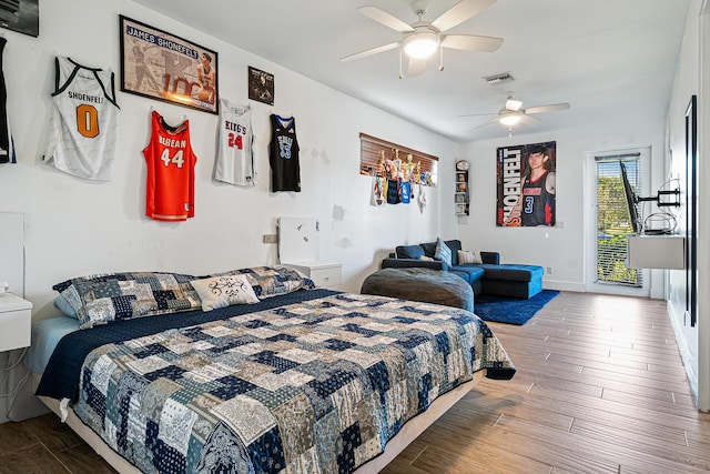 11951 Torreyanna Cir, Palm Beach Gardens, FL 33412 - bedroom featuring access to exterior, visible vents, ceiling fan, wood finished floors, and baseboards
